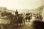 Photograph of a horse drawn cart funeral procession. 