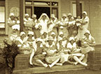 Photograph of a group of Karitane nurses holding babies and toddlers.